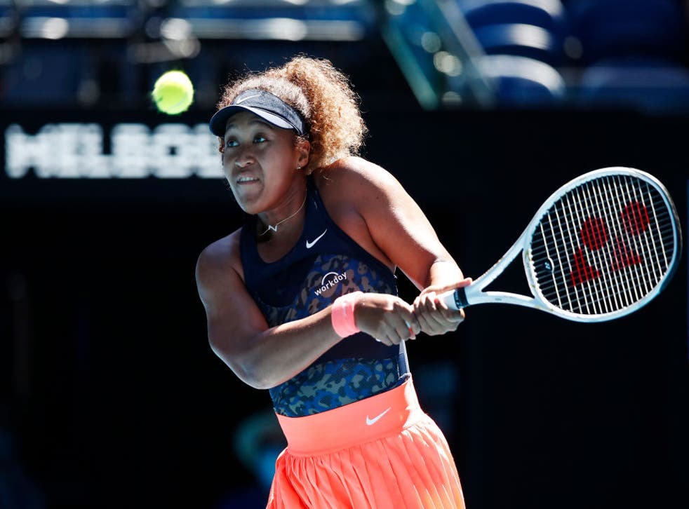 <p>Naomi Osaka plays a backhand against Serena Williams</p>