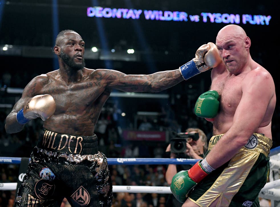 Deontay Wilder punches Tyson Fury in their first fight in 2018