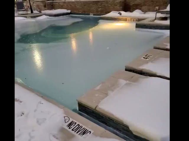 <p>Twitter user Thomas Black shares a video of a frozen swimming pool in Dallas, Texas</p>