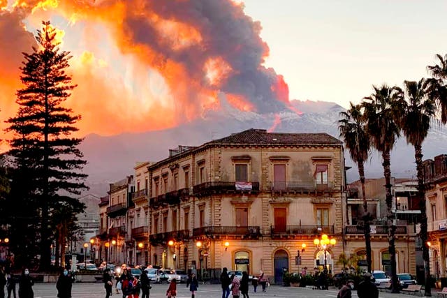 Mount Etna spews ash and lava, as seen from Catania