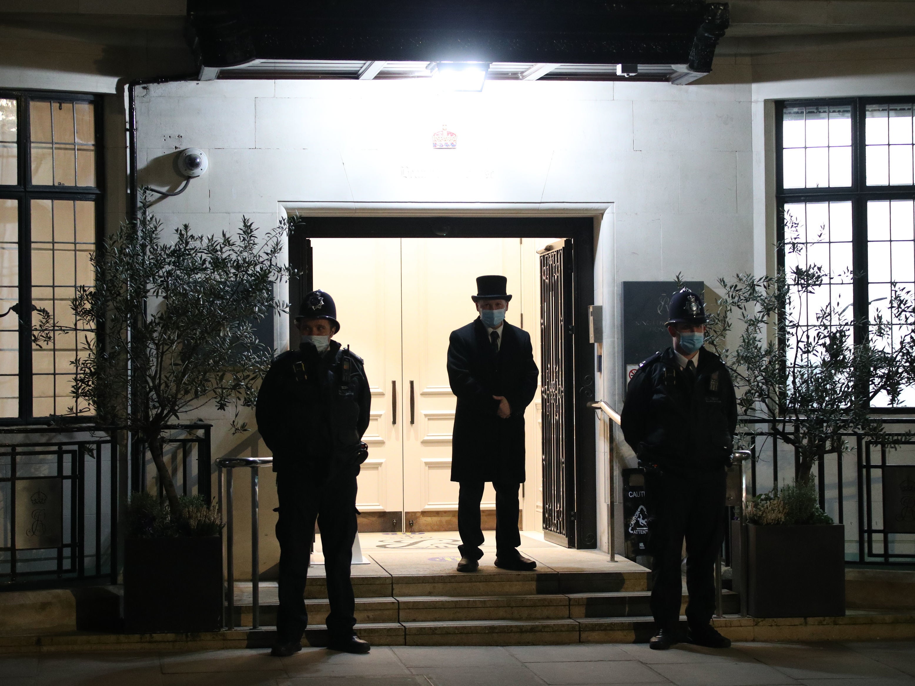 Police officers and a doorman outside the King Edward VII Hospital in London where the Duke of Edinburgh was admitted on Tuesday evening as a precautionary measure after feeling unwell