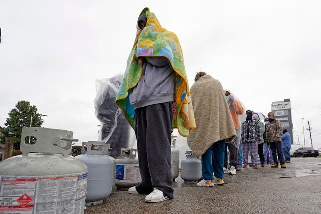 <p>Customers queue up for over an hour in the freezing rain to fill their tanks n 17 February. </p>