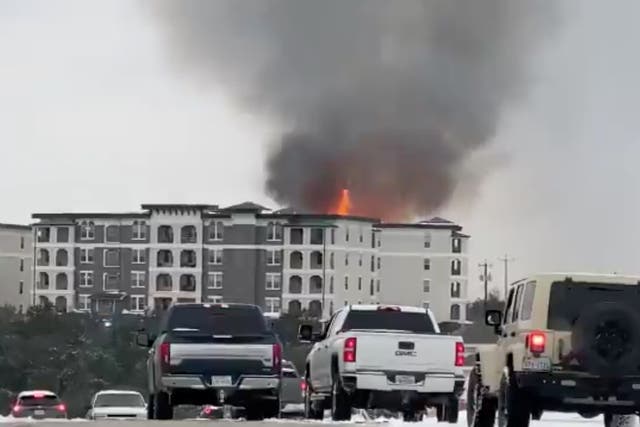 <p>Smoke rises from a building on fire, in San Antonio, Texas, US February 18, 2021, in this still image taken from a social media video. </p>