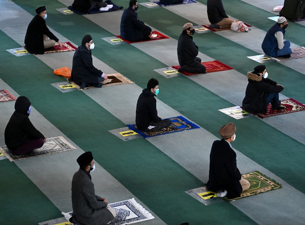 <p>Muslim men take part in socially distanced Friday prayers</p>