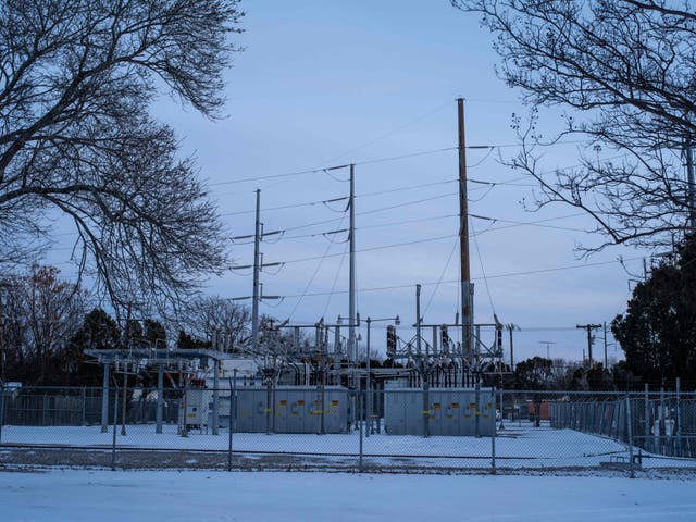 <p>An Oncor power substation is surrounded by snow in Waco, Texas, on 18 February, 2021</p>