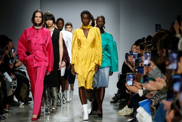 <p>Models walk the runway during the Lutz Huelle show at Paris Fashion Week last year</p>