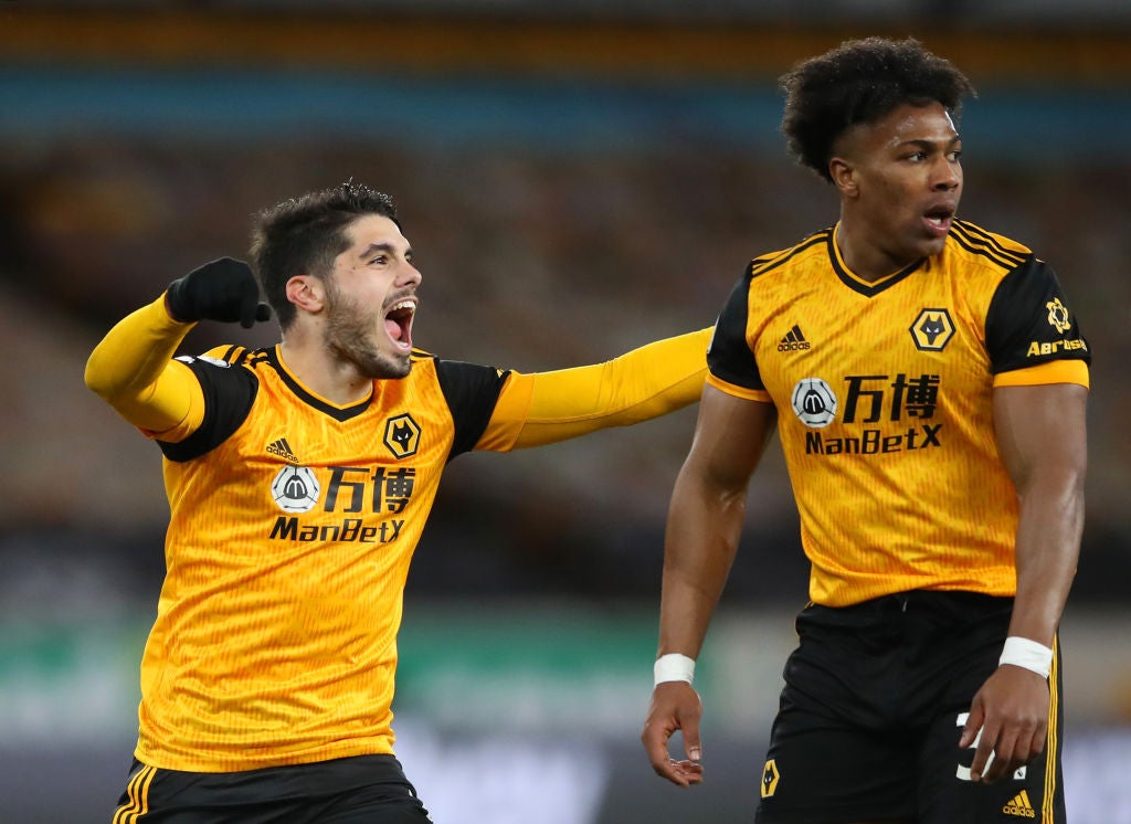 Pedro Neto celebrates with Adama Traore