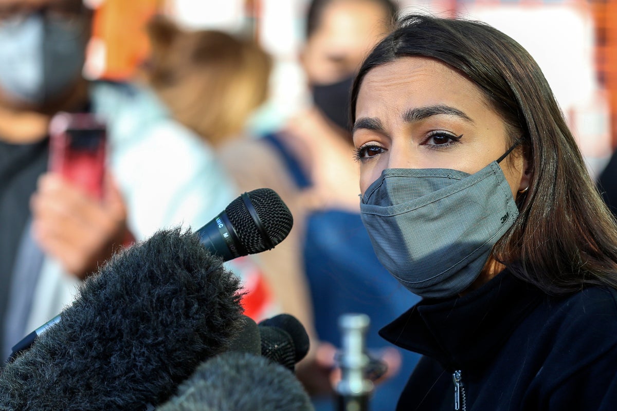 AOC volunteers at Houston food bank after raising more than $3 million for  Texas storm victims | The Independent