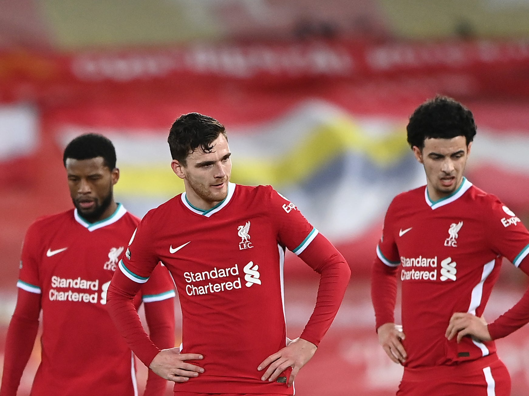 Liverpool players react to their defeat by rivals Everton