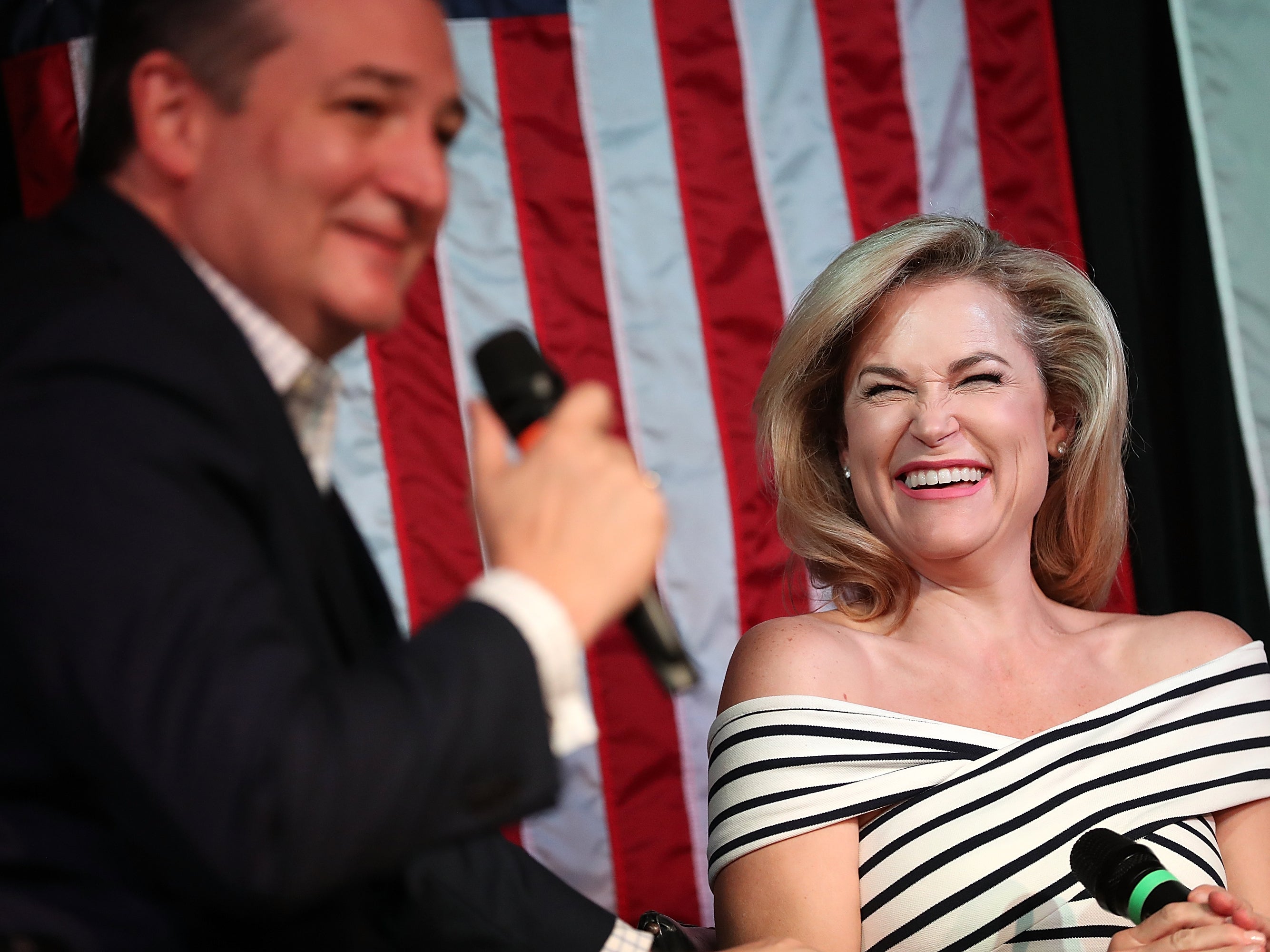 <p>Senator Ted Cruz (R-TX) speaks as his wife Heidi Cruz (R) looks on during a Women for Cruz rally on 3 November 2018 in Houston, Texas</p>