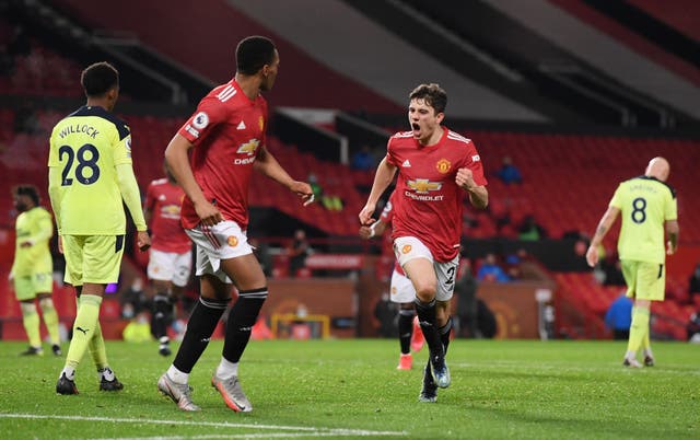 <p>Daniel James celebrates scoring United’s second</p>