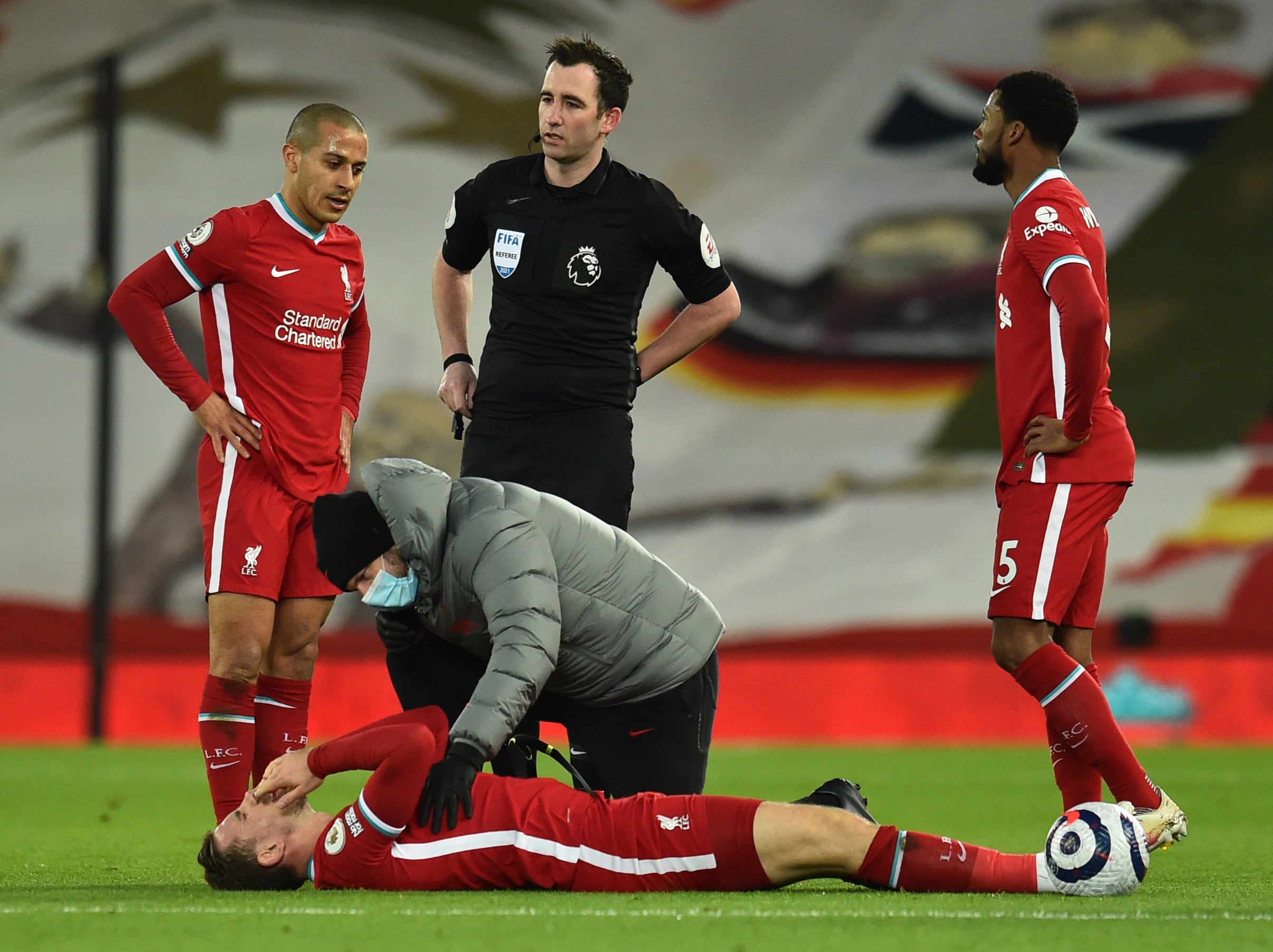 Jordan Henderson suffers an injury during Liverpool’s defeat by Everton