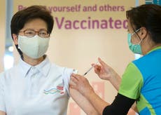 Hong Kong leader, top officials receive COVID-19 vaccine