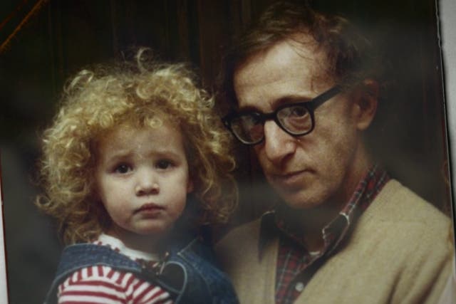 <p>An old photo of Woody Allen, with his adopted daughter Dylan Farrow who accused him of sexually harassing her when she was a child </p>