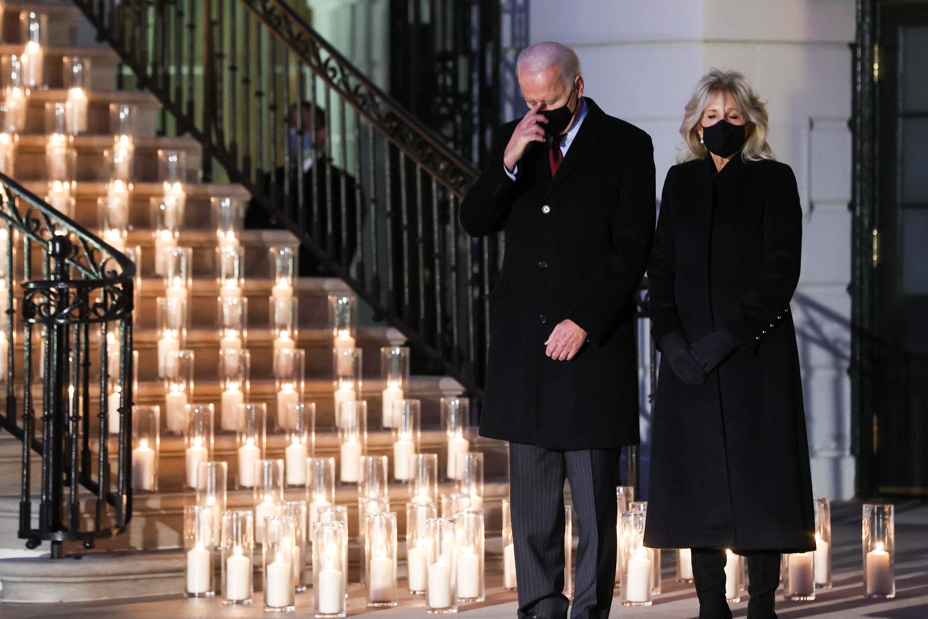 President Joe Biden commemorates the grim milestone of 500,000 U.S. deaths from the coronavirus disease (COVID-19) during a moment of silence and candle lighting ceremony at the White House in Washington