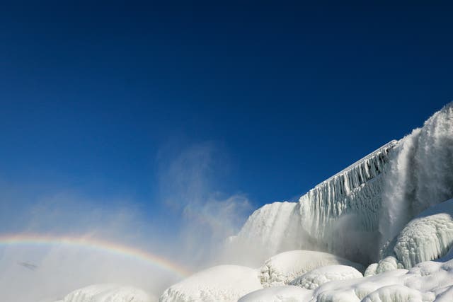 <p>Water flowing around ice at the base of the American Falls due to cold temperatures in Niagara Falls, New York, on 21 February 2021</p>