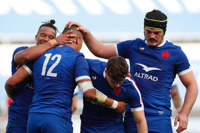 France players celebrate scoring a try