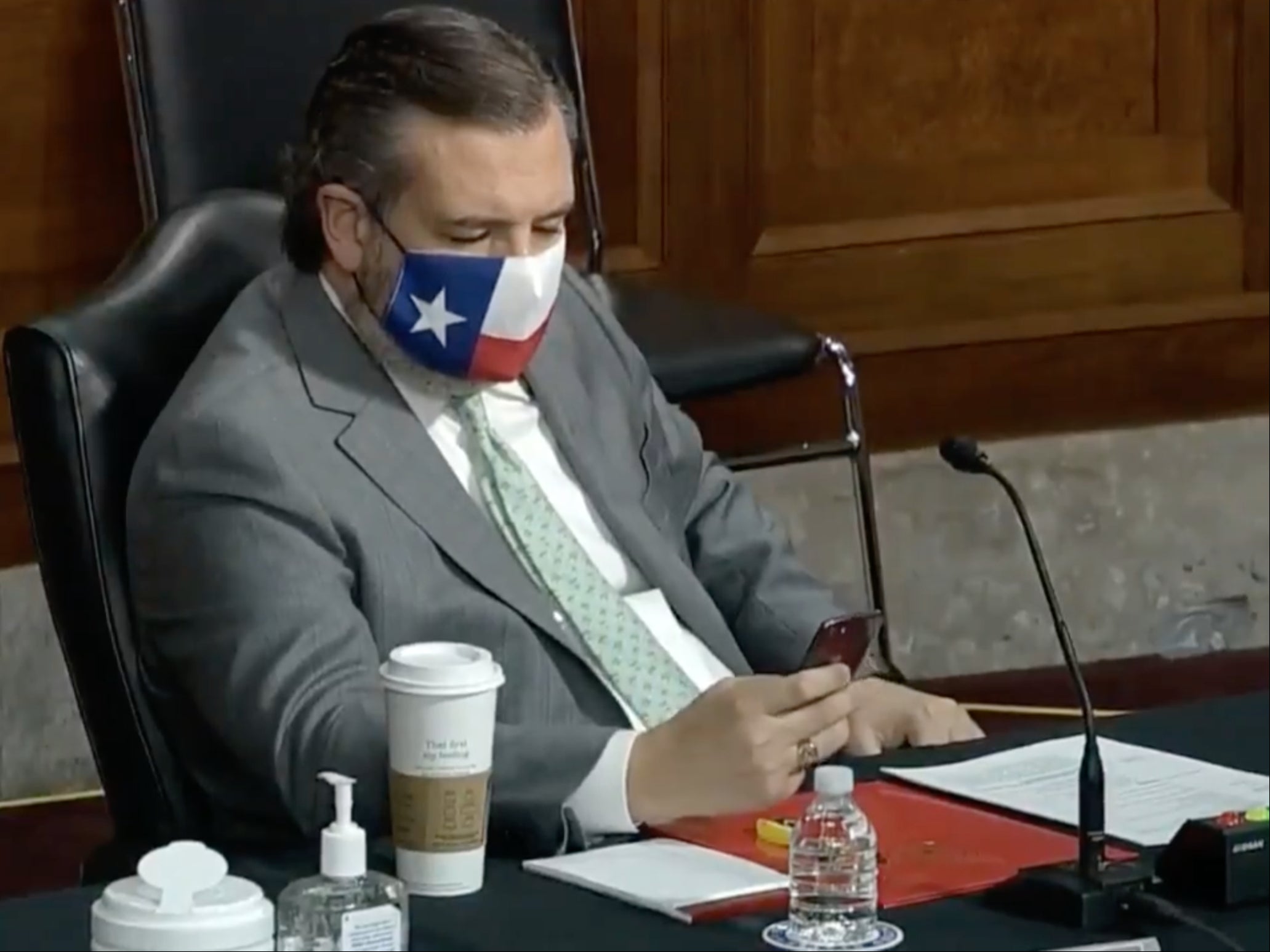 Ted Cruz pictured scrolling through phone during opening testimony