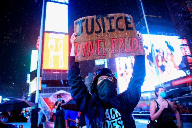 <p>File Image: A demonstrator holds a sign during a protest to demand justice for Daniel Prude, on 3 September  2020 in New York City</p>