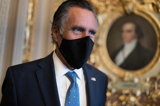<p>Mitt Romney, R-Utah, pauses to answer questions from reporters as senators arrive to vote on President Joe Biden’s nominee for United Nation’s ambassador, Linda Thomas-Greenfield, at the Capitol in Washington, on Tuesday 23 February 2021</p>