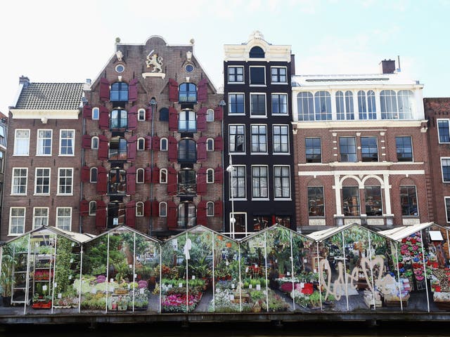 A general view of the canal houses or grachtenpand in Dutch and flower market on Singel on May 11, 2016 in Amsterdam, Netherlands