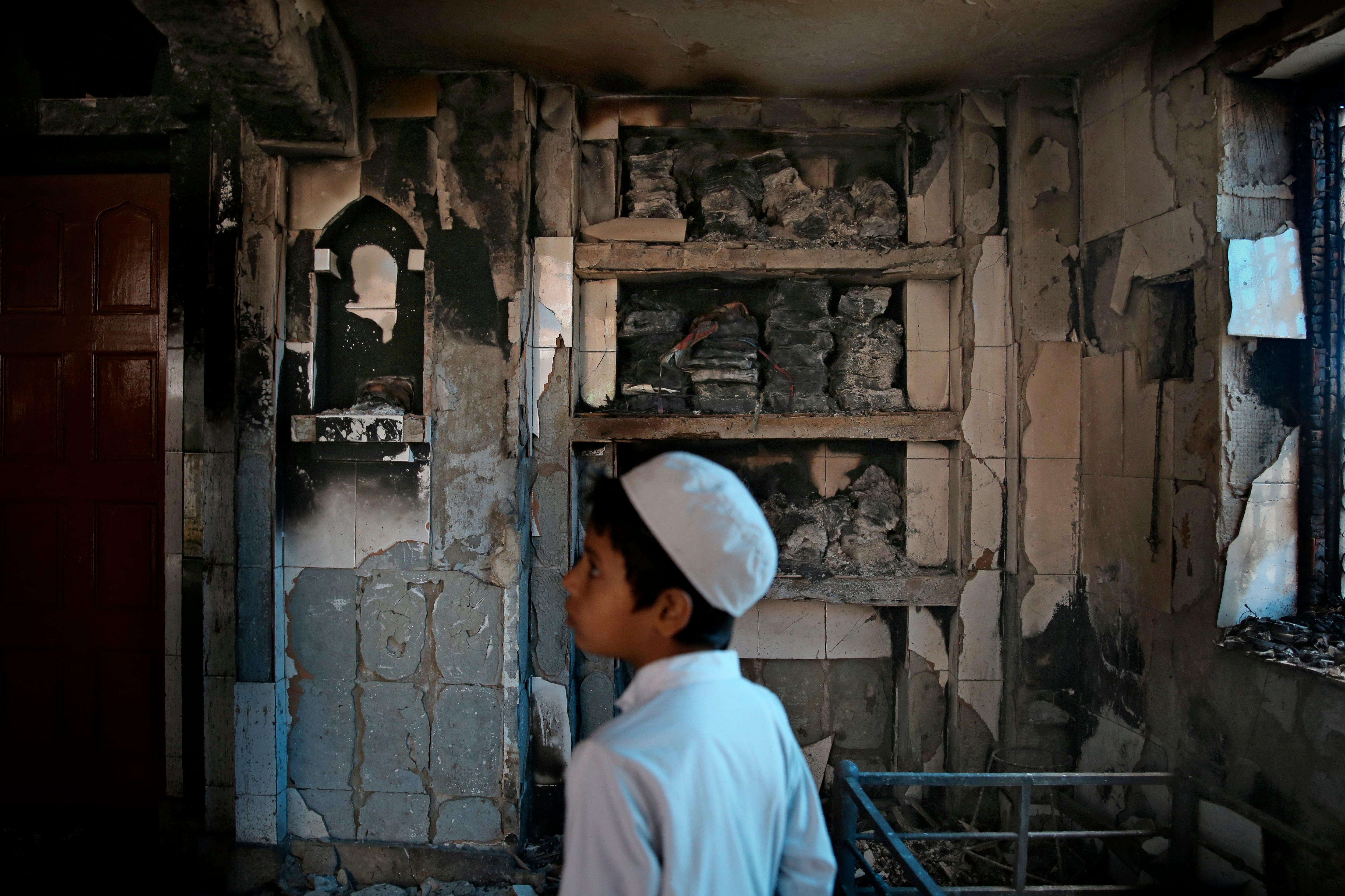 A mosque burnt last year in the riots in north-east Delhi