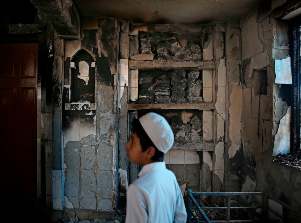 <p>A mosque burnt last year in the riots in north-east Delhi</p>