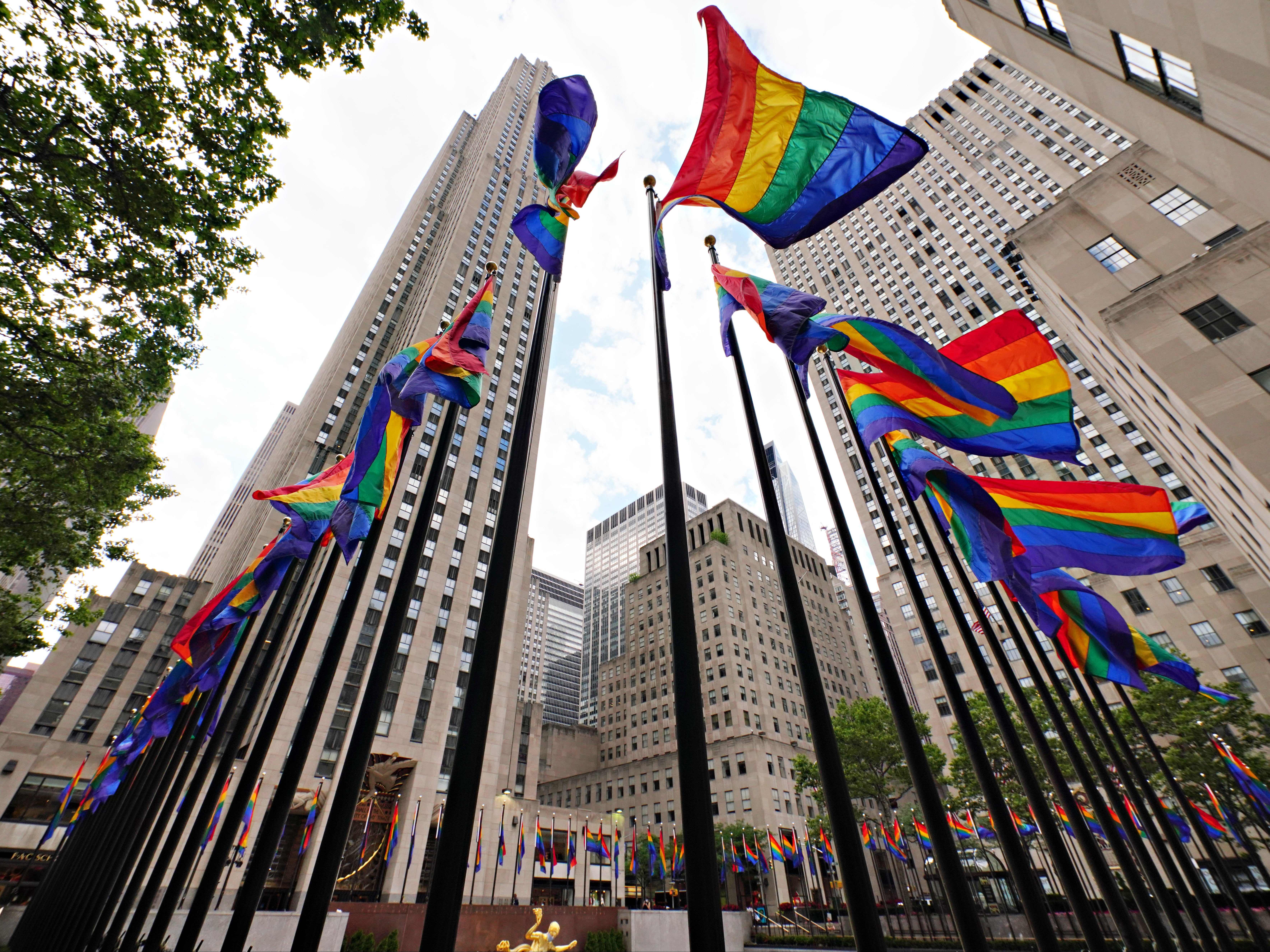 <p>In celebration of Pride, more than 100 rainbow-coloured flags line the Rink at Rockefeller Centre on 26 June 2020 in New York City</p>