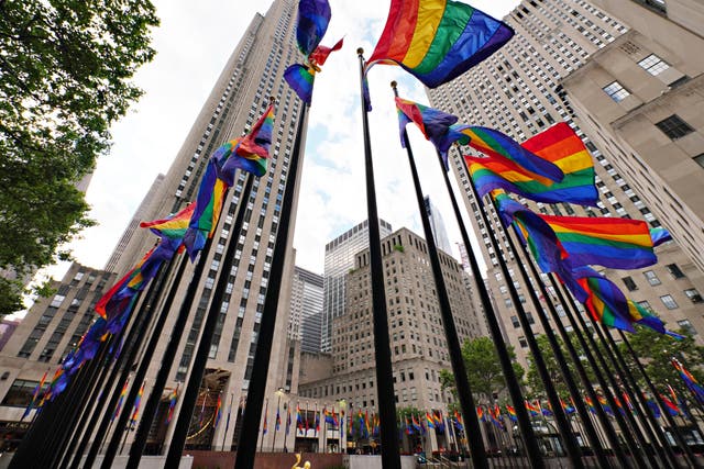 <p>In celebration of Pride, more than 100 rainbow-coloured flags line the Rink at Rockefeller Centre on 26 June 2020 in New York City</p>