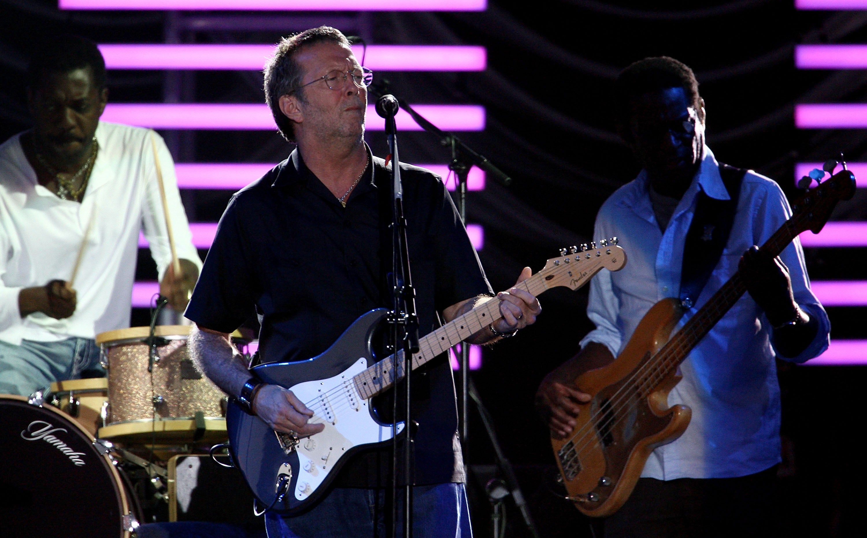 Eric Clapton performs on stage in Perth, Australia, in 2011, with a Fender Stratocaster guitar.