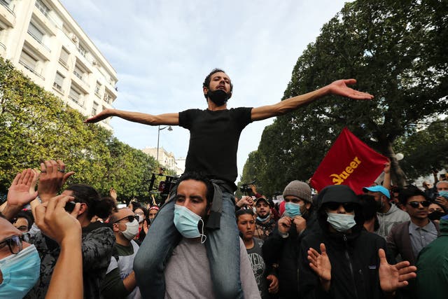  Tunisian anti-government protesters earlier this month on the streets of Tunis