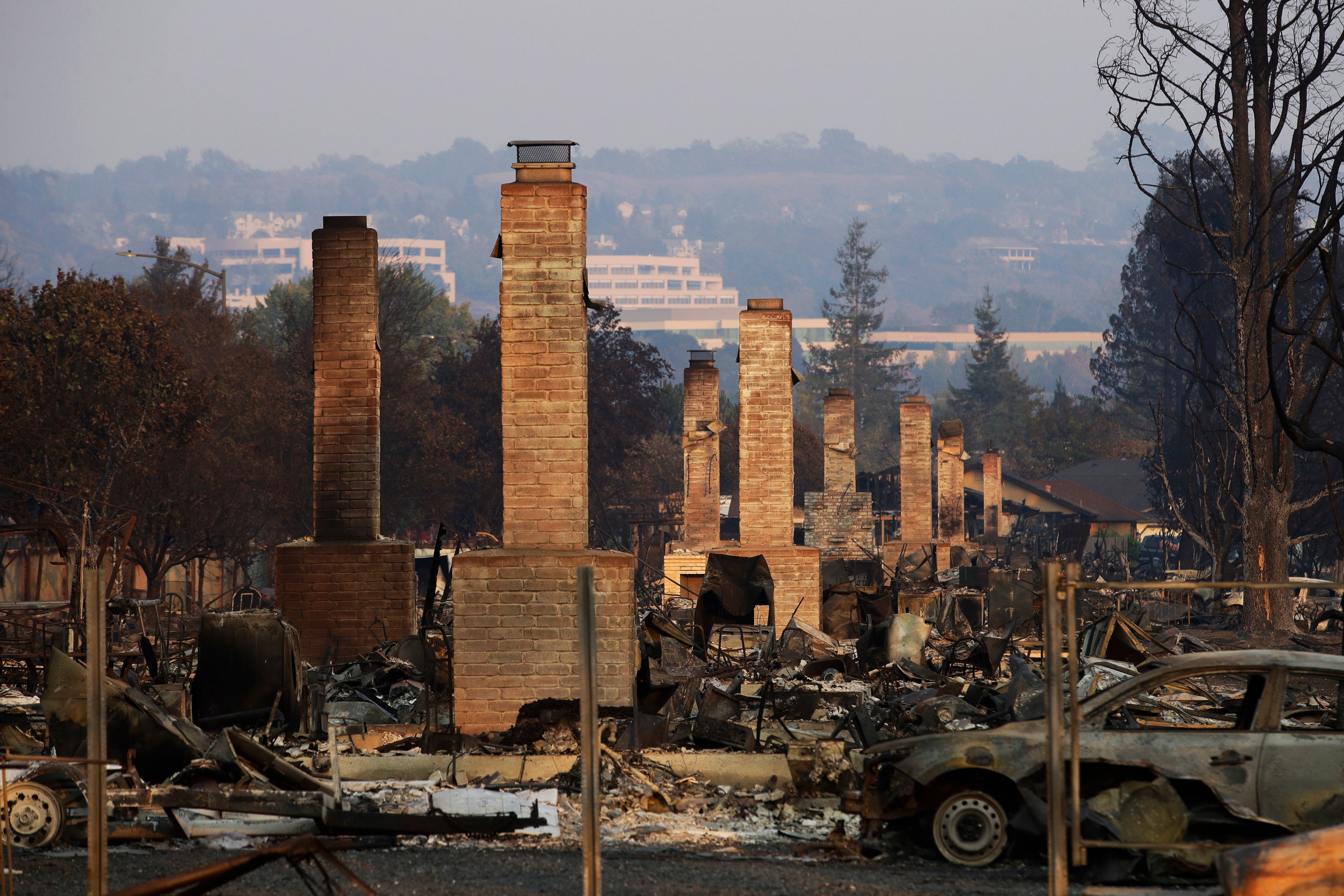 A row of chimneys stand in a neighborhood devastated by the Tubbs fire near Santa Rosa, Calif.