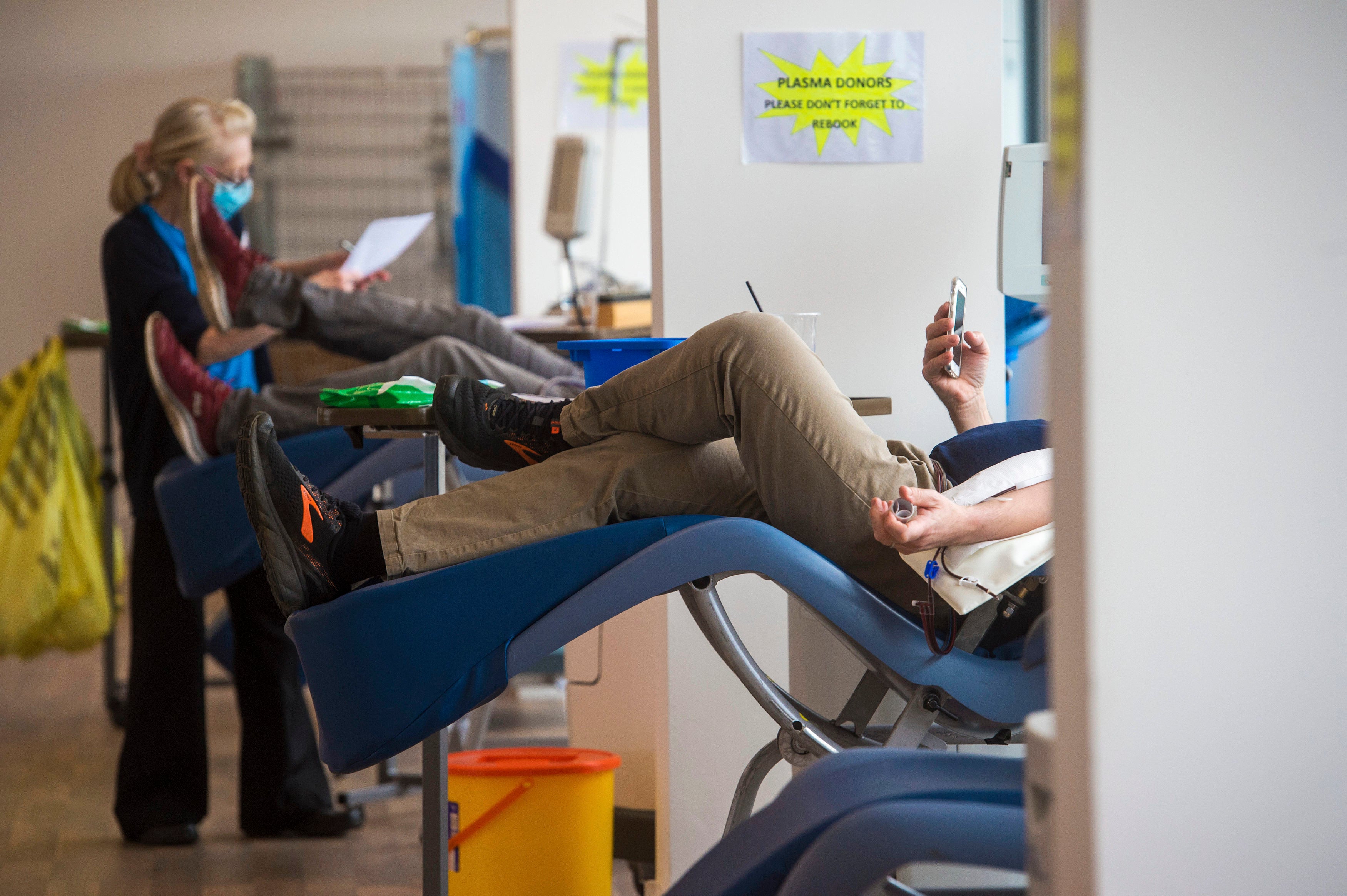 <p>Donors gives blood plasma to the NHS Blood and Transplant Convalescent Plasma Programme at the Twickenham plasma pop-up centre in west London</p>