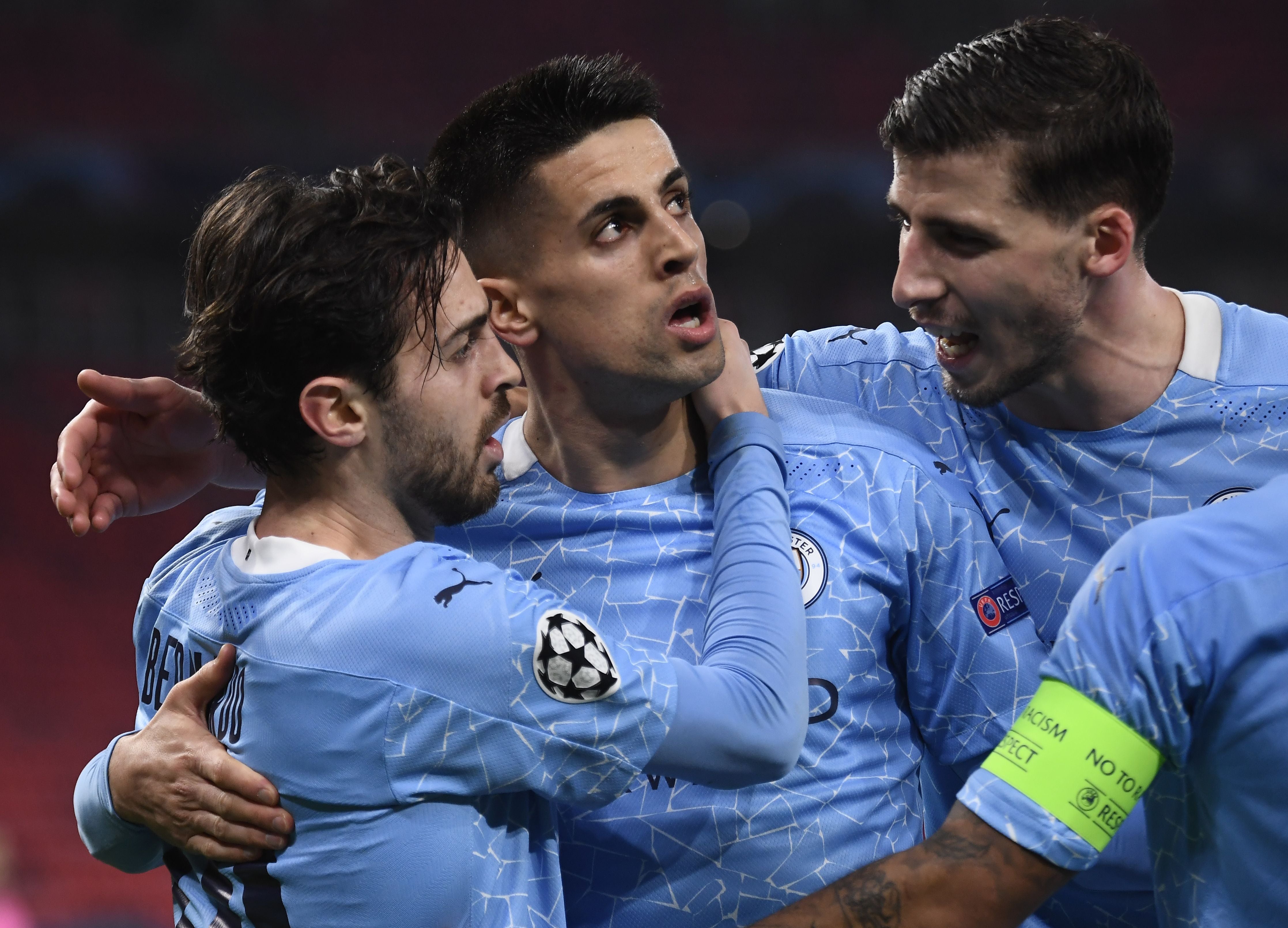 Bernarod Silva and Joao Cancelo celebrate Manchester City’s first goal