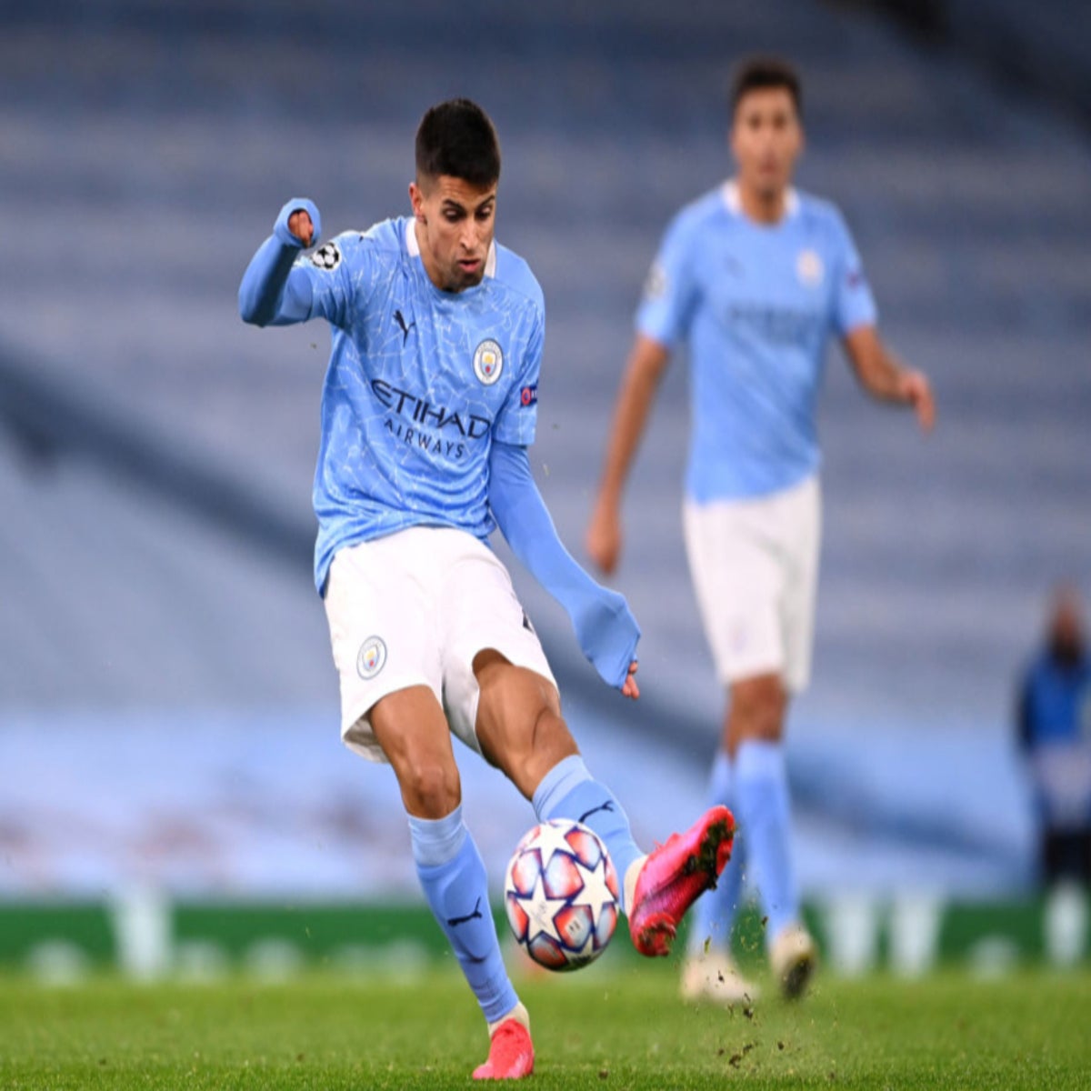 Manchester City's Joao Cancelo heads the ball during the Champions