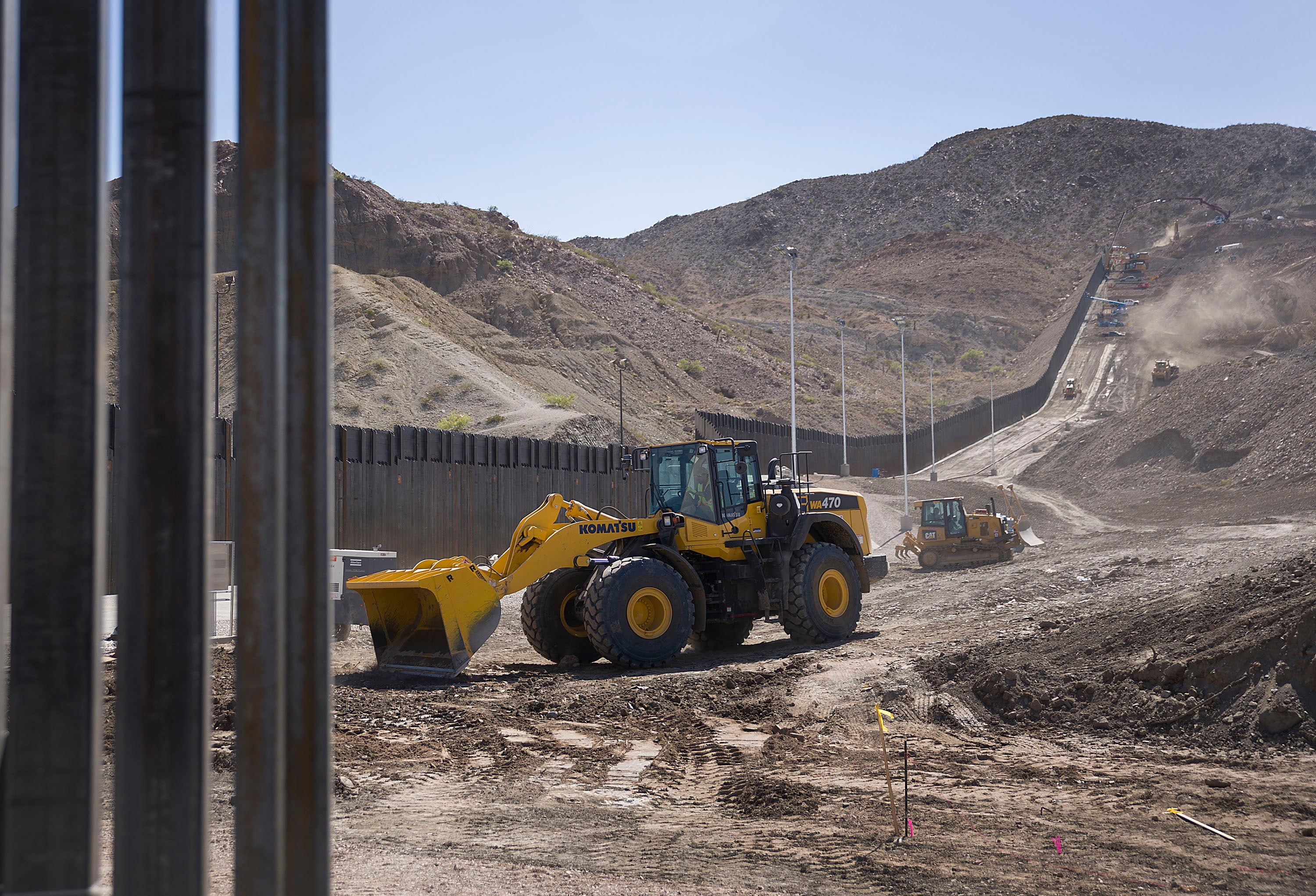 Construction crews work on a border wall being put in place by We Build The Wall Inc. on June 1, 2019 in Sunland Park, New Mexico