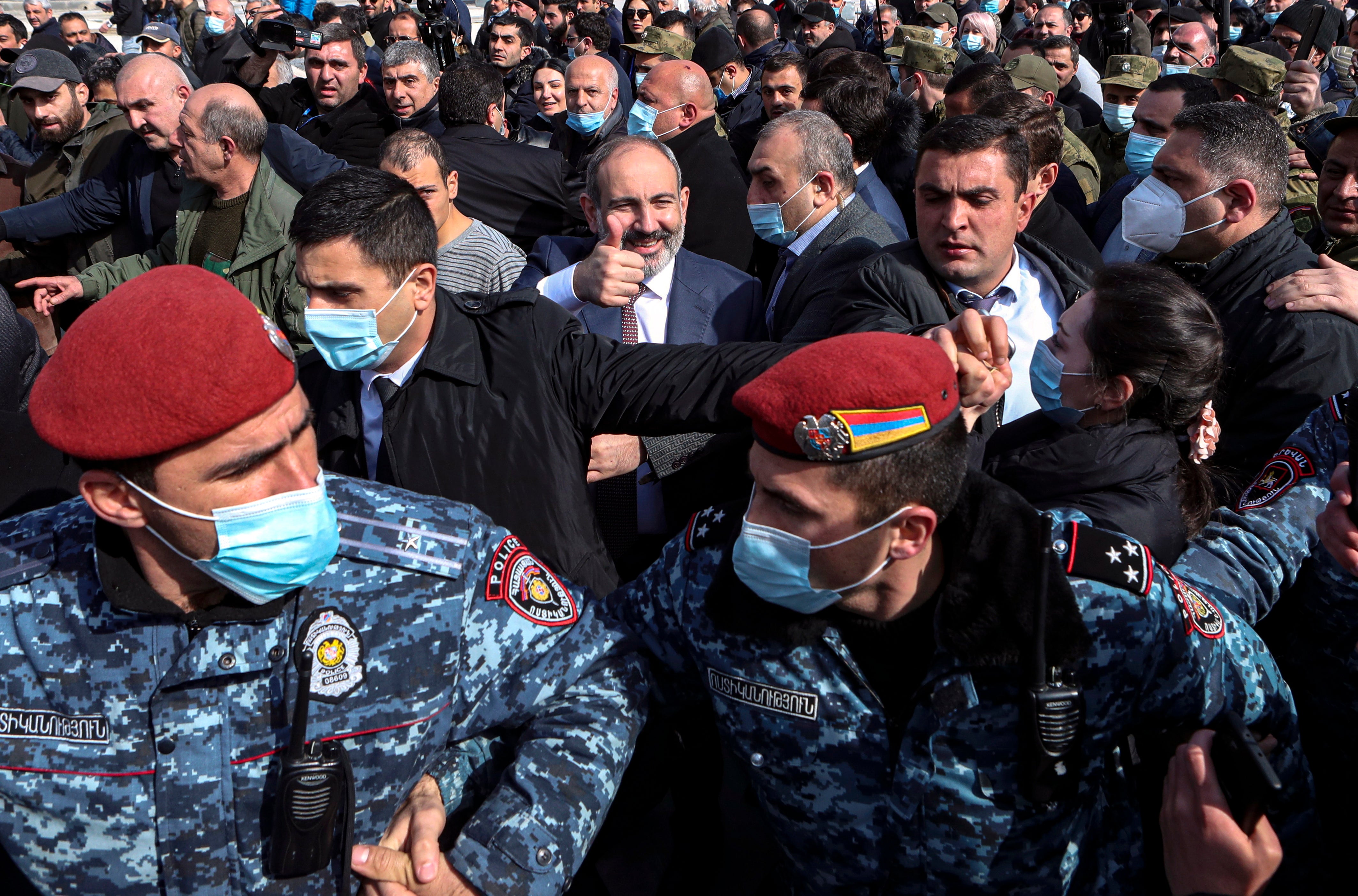 Nikol Pashinyan (centre) greets people while walking with his supporters on the streets in downtown of Yerevan, Armenia