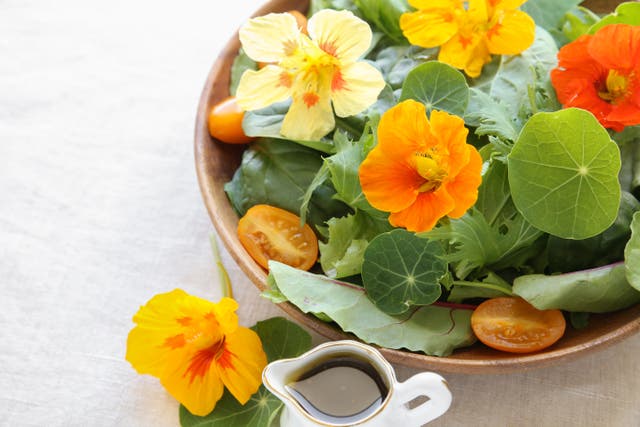 Fresh green salad with edible flowers (iStock/PA)