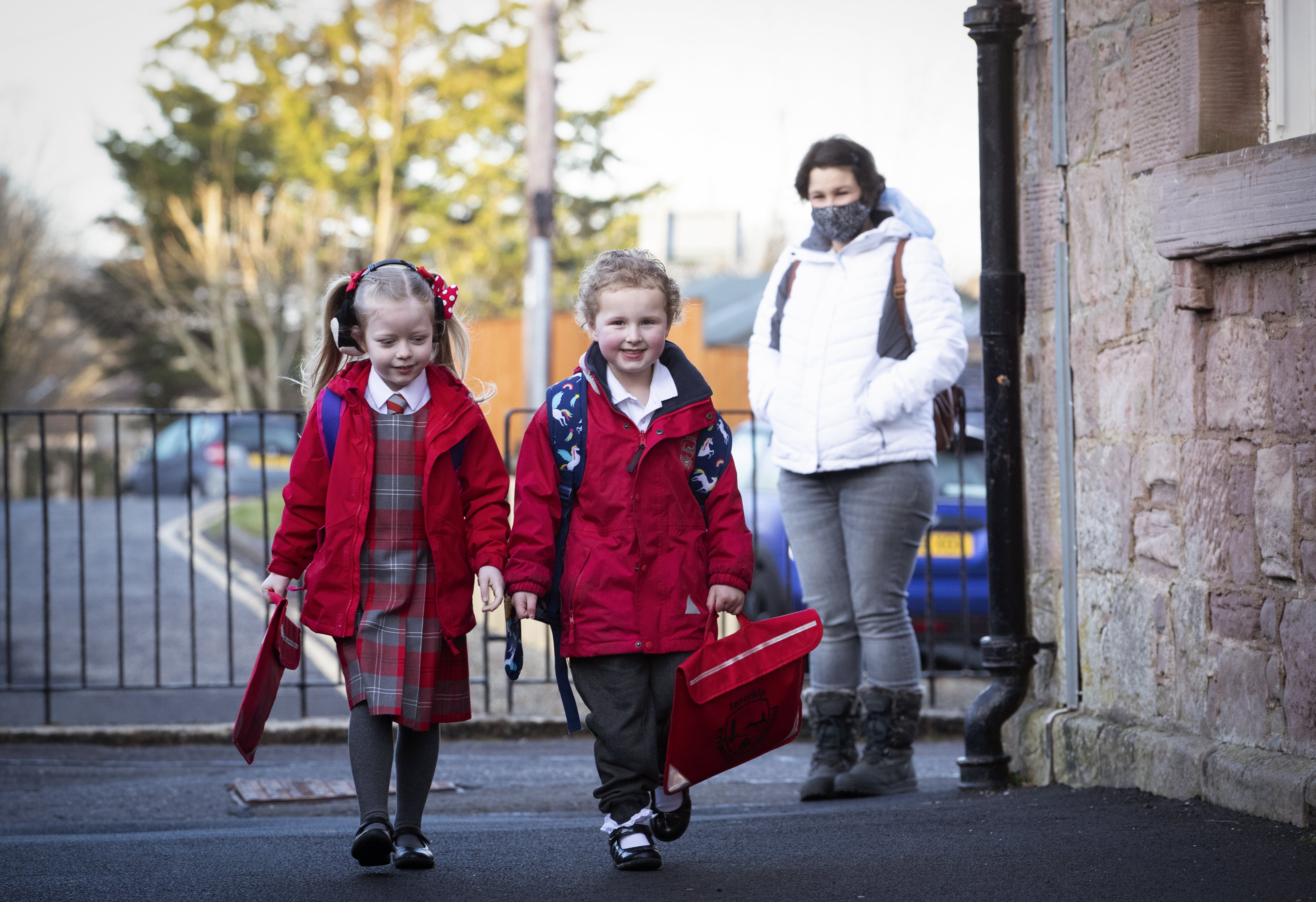 P1 pupils Grace Lee (left) and classmate Grace McKeeman, both aged 5, arrive for their first day back at Inverkip Primary School.
