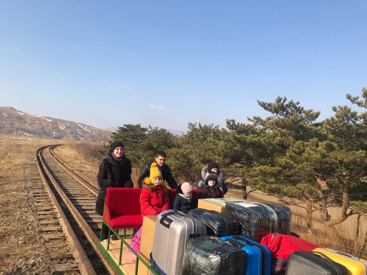 <p>Russian diplomat pictured crossing North Korean border on handcar with his family</p>