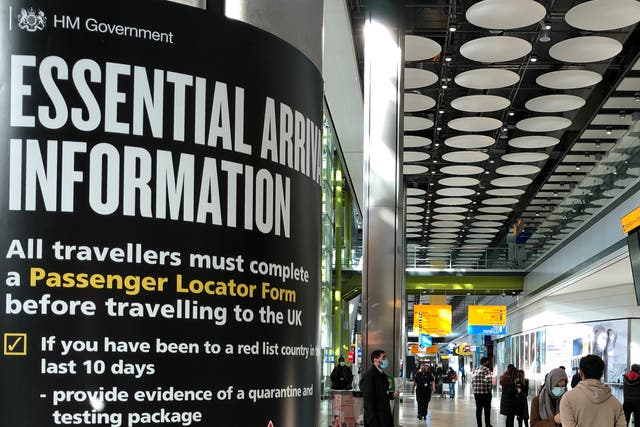 Red alert: sign for arriving travellers at Heathrow airport Terminal 5