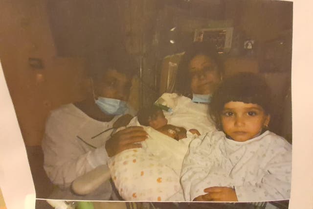 <p>Hajar and Rupak Sharif (left and middle) lost their third child, Aleksandra, after they were prevented from accessing urgent medical care by French police</p>