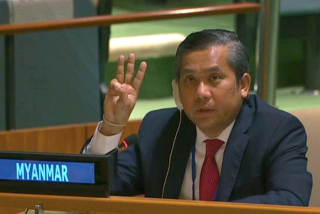 <p>Myanmar’s ambassador to the United Nations Kyaw Moe Tun holds up three fingers at the end of his address</p>