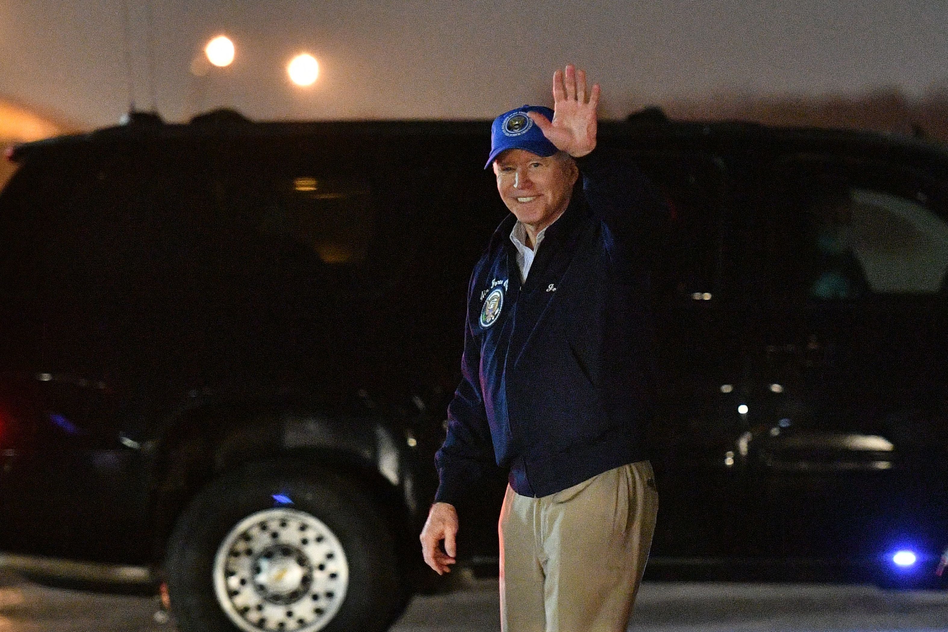 Joe Biden waves upon arrival at Andrews Air Force Base in Maryland on Friday