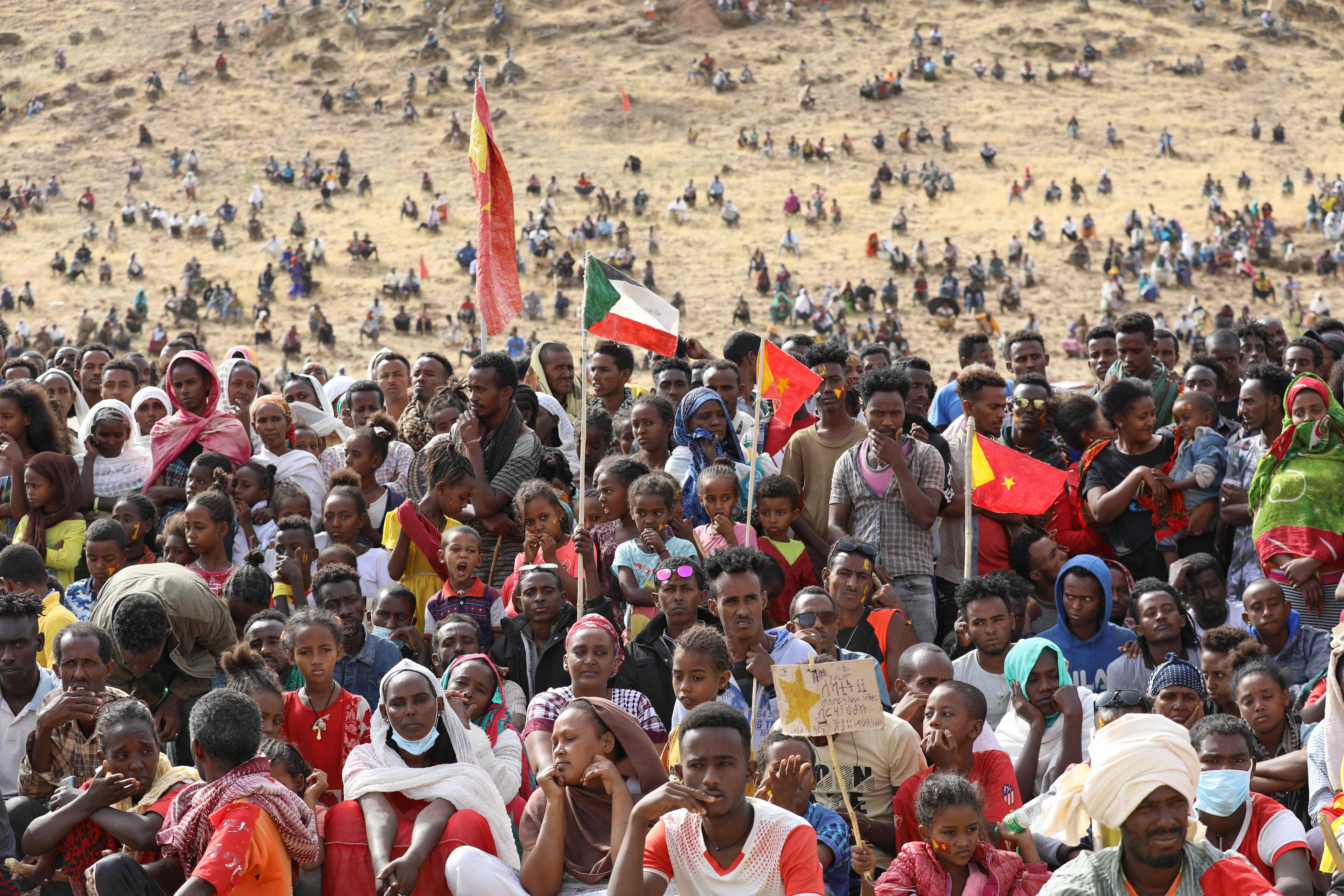 <p>Ethiopian refugees gather to celebrate the 46th anniversary of the Tigray People's Liberation Front at Um Raquba refugee camp in Gedaref, eastern Sudan, on 18 February 2021</p>