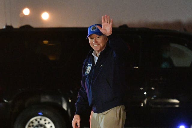 President Joe Biden waves upon arrival at Andrews Air Force Base in Maryland on February 26, 2021.