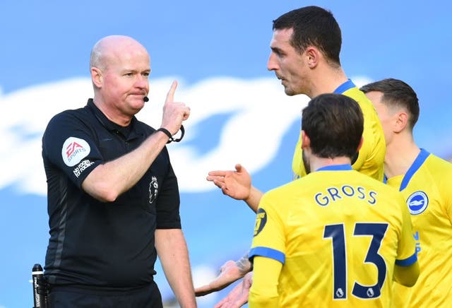<p>Lewis Dunk remonstrates with Referee Lee Mason</p>