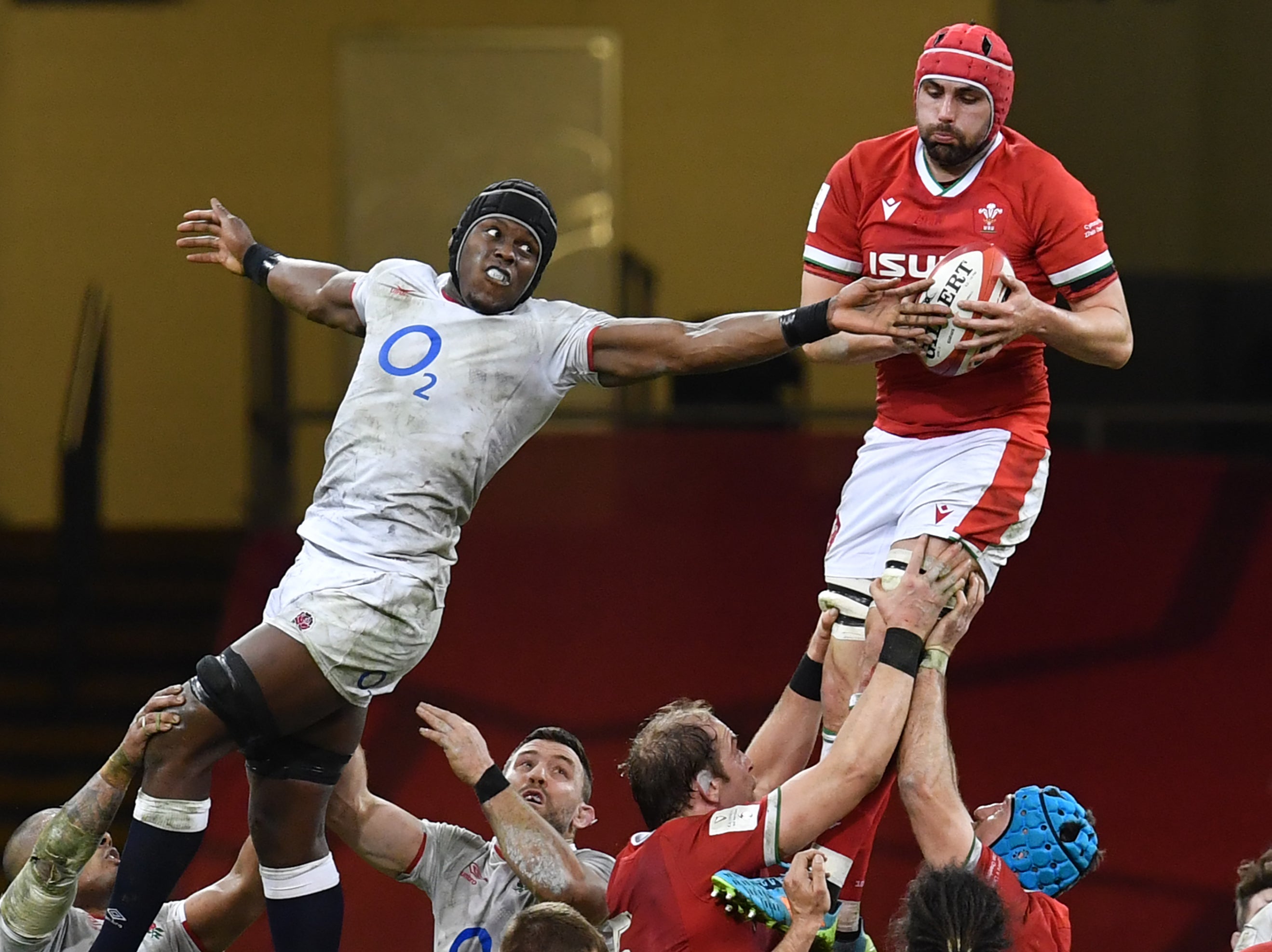 Wales’ Cory Hill wins the ball from England lock Maro Itoje in the line-out
