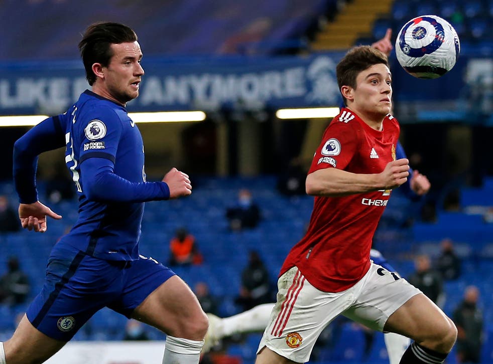 Chelsea’s Ben Chilwell and United’s Dan James compete for the ball
