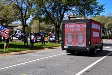 Trucks outside CPAC with January 6th Reunion on them ahead of Trump speech